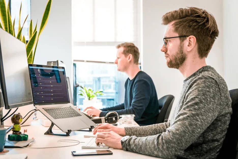 Two colleagues in training in an office